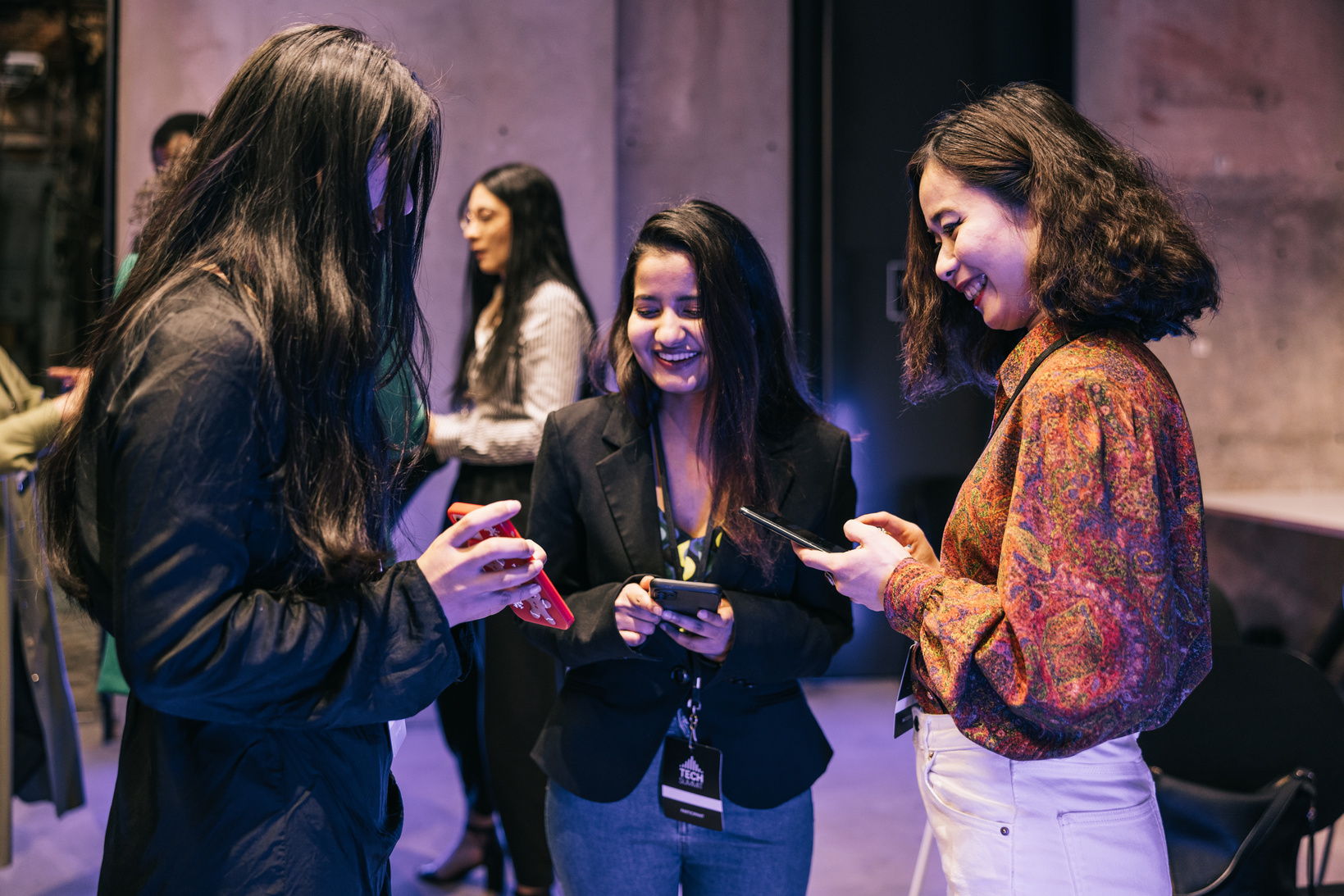 Colleagues Exchanging Contacts at an Event 
